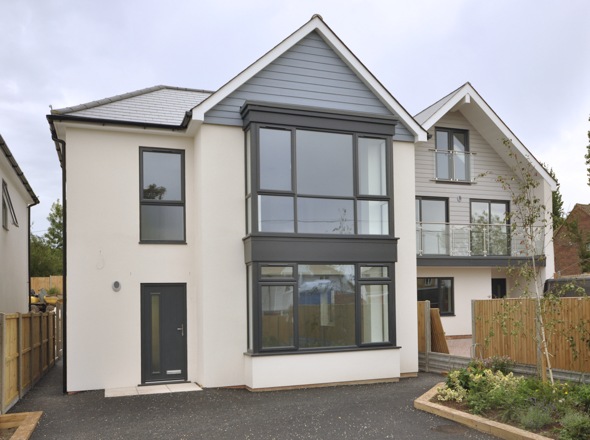 3 House scheme in village location, two houses are reflections of each other, whilst the third is of a different design.  Design: Nick Baldry